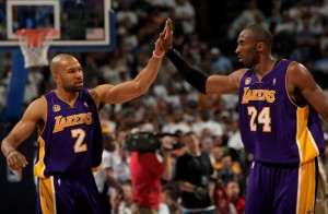 derekfisher_kobe Derek Fisher and Kobe Bryant are one victory away from earning their fourth championship ring. (GETTY IMAGES)